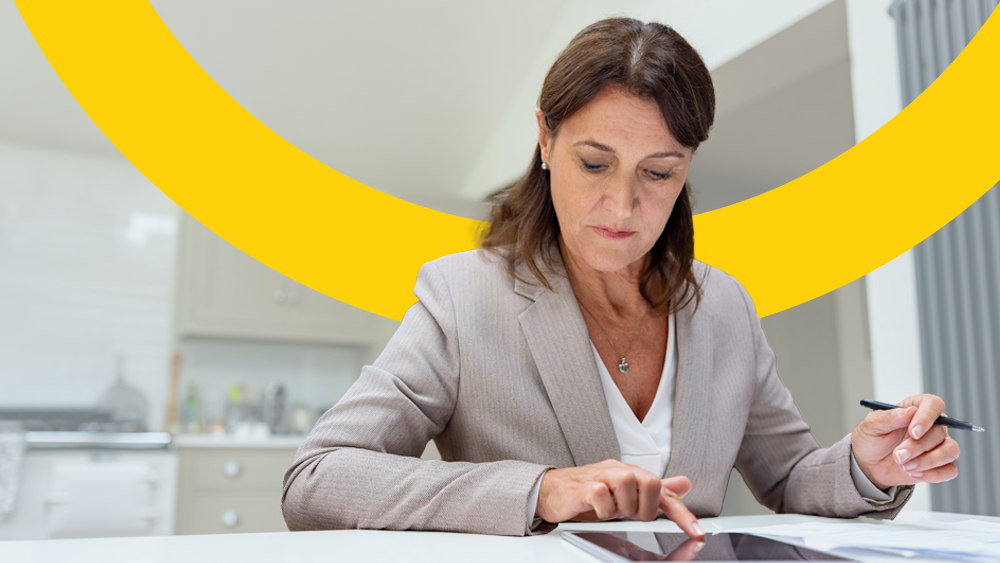 A woman using a tablet for Making Tax Digital
